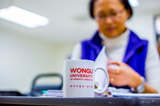Image of student with Wongu University cup