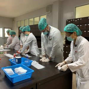 Students prepare formulas in a lab.