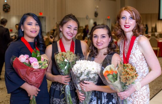 Photo of 4 graduates together