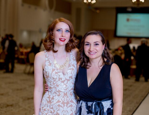 photo of two graduates