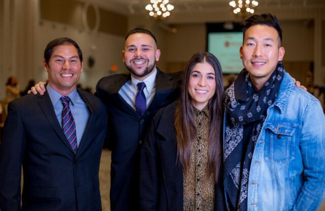 photo of graduates and friends and students