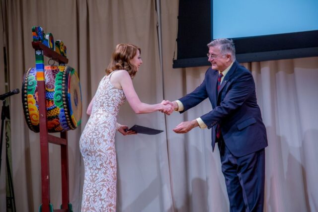photo of graduate and president