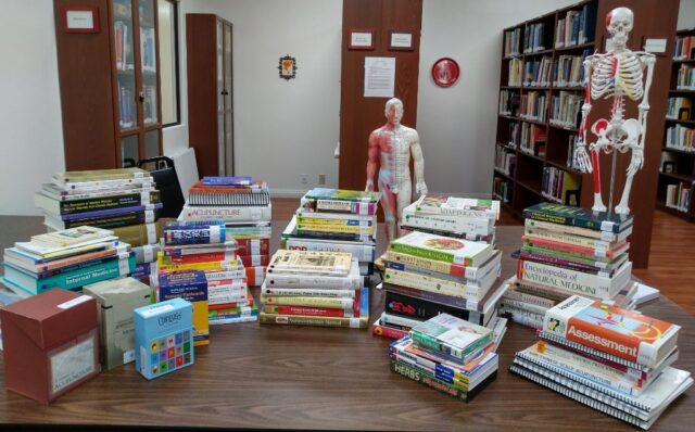 Donated books and materials on a table.